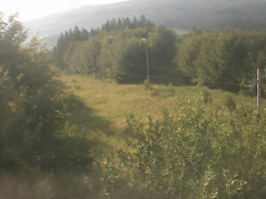 Skiareál Troják - Kamera na svahu B, pohled od chaty - 15.8.2025 v 07:49